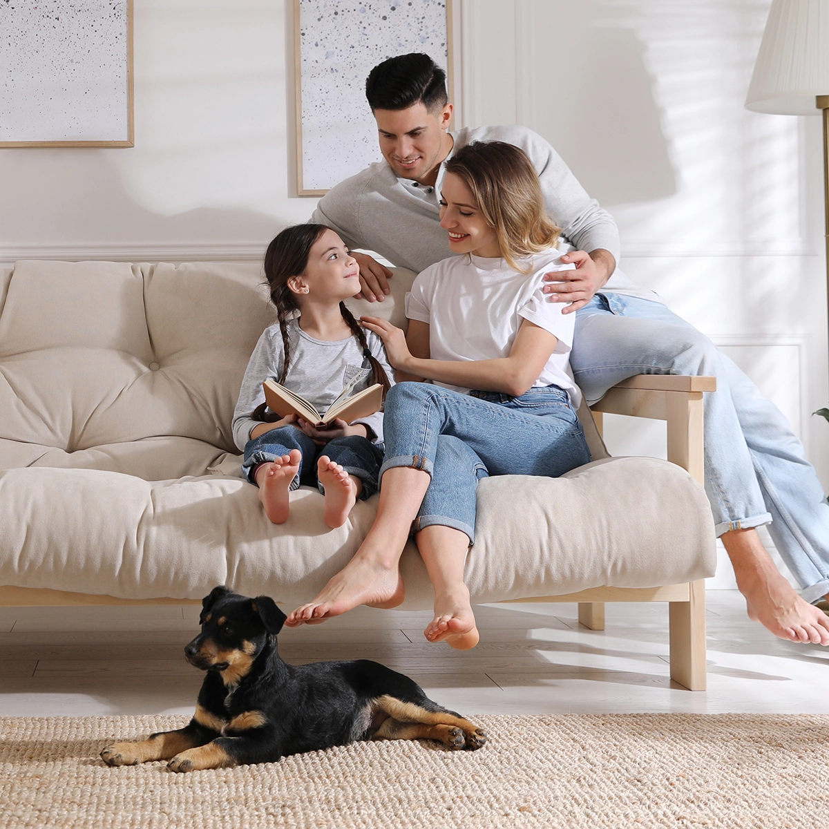 Weybridge family on a sofa after cleaning by Grease Lightning